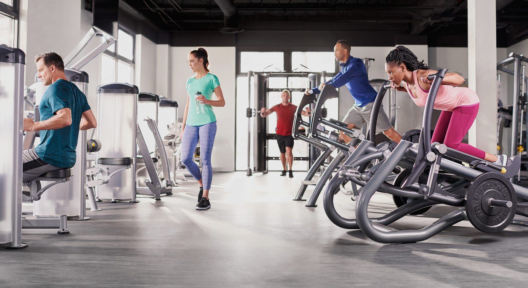 People exercising in health club